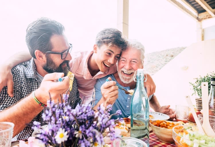Family eating and laughing together