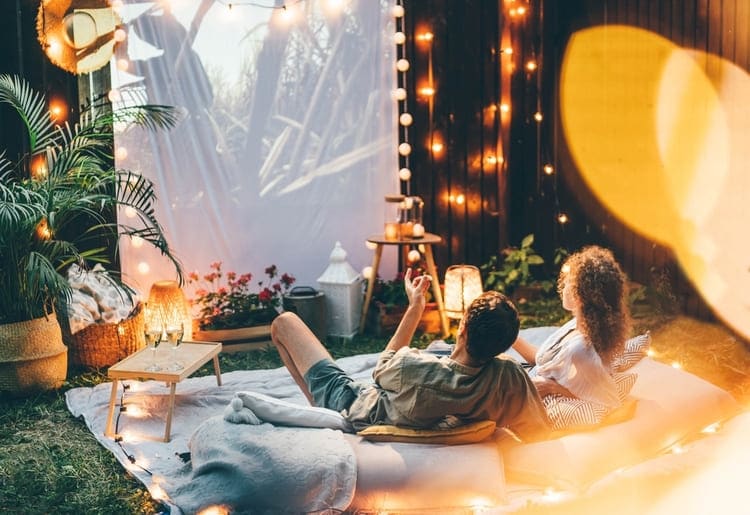 Try creative dates, like a makeshift backyard movie theater.