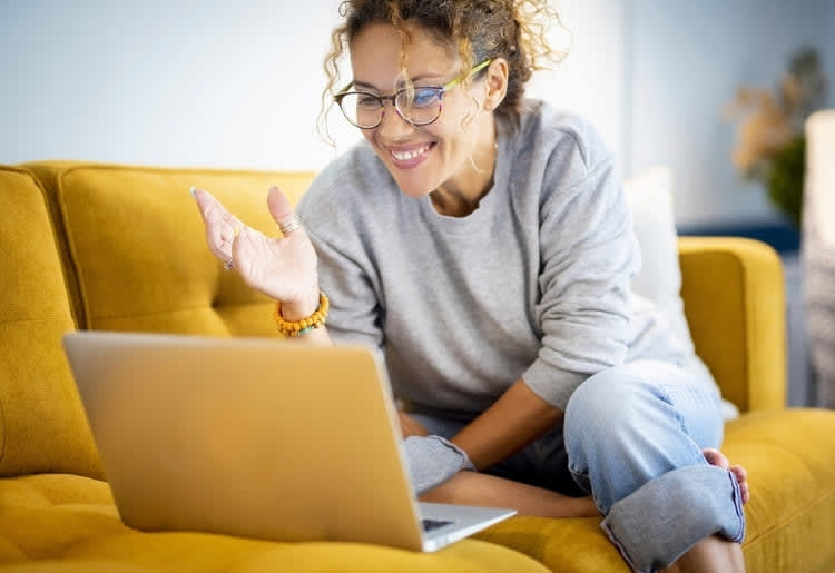 How Therapy Can Help With the Coming Out Process A woman talking to an online therapist about the coming out process.